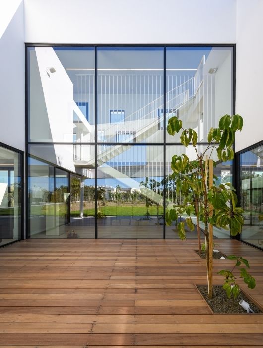 six pane silicone bonded double height glass wall