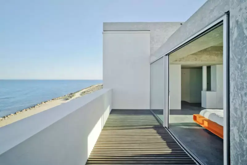 two pane slim sliding aluminium door used as a seafront balcony door