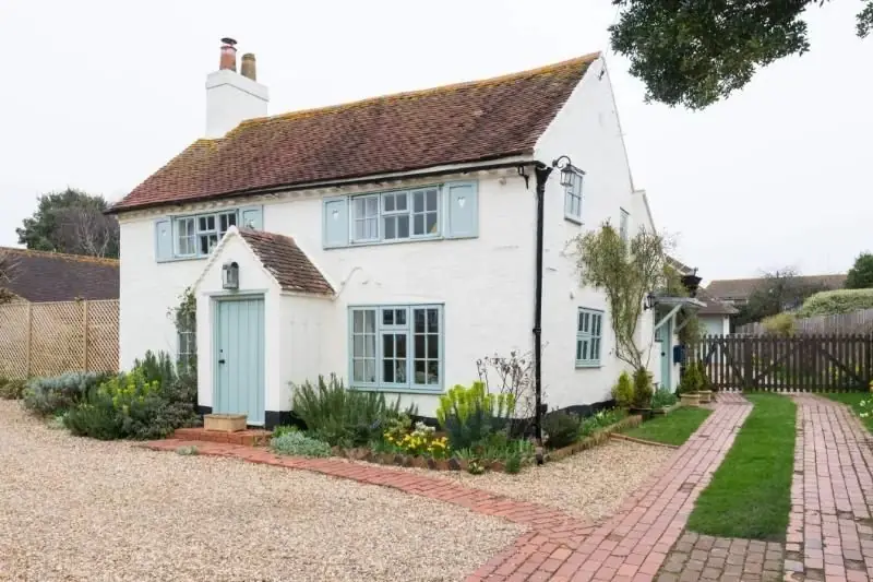 light blue rural entrance door on a traditional English cottage