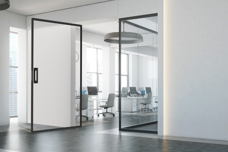 miro pivot internal glass pivot door with slim aluminium framing in a modern office space