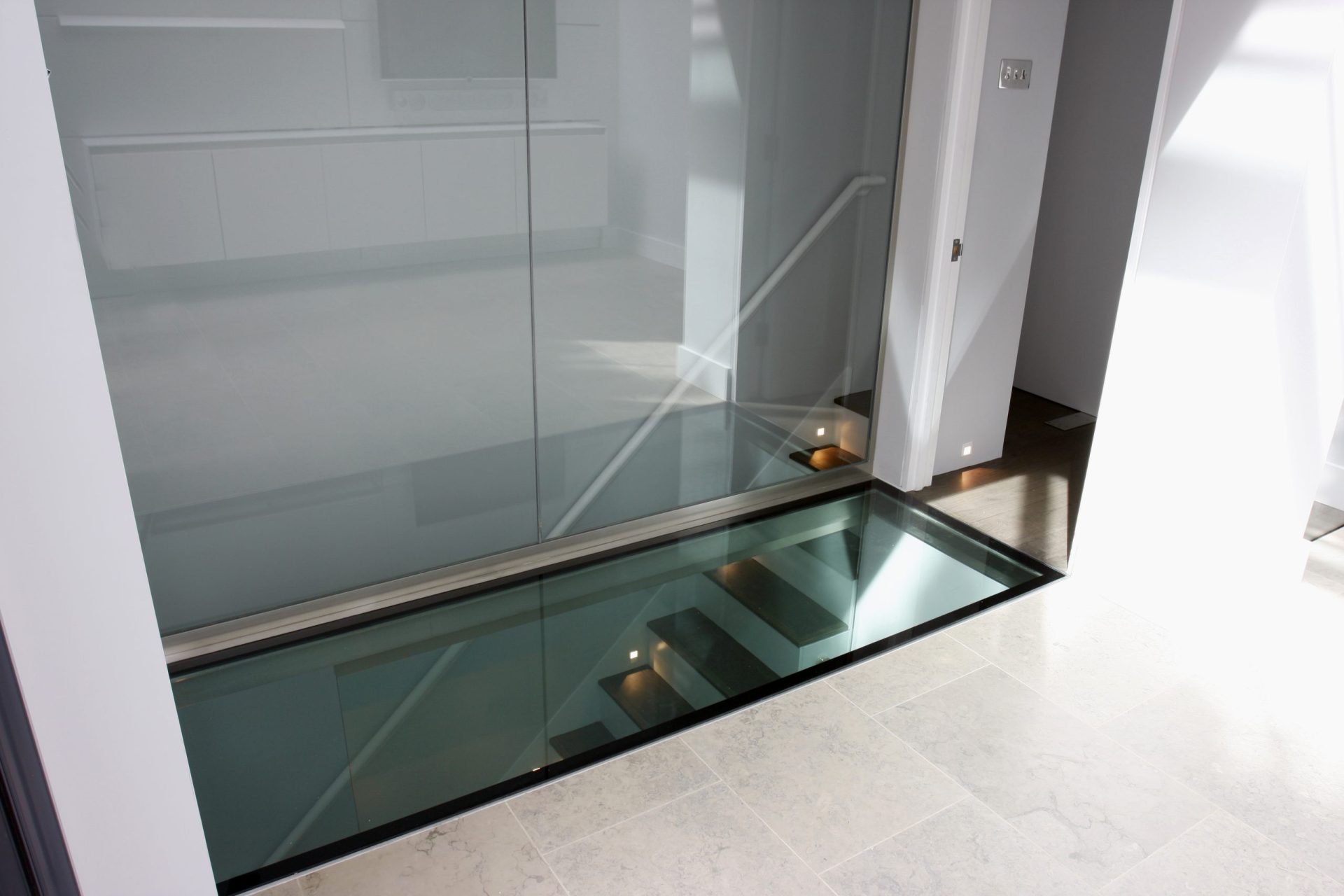 stairs protected by a fire rated glass floor - paulston square - sieger systems