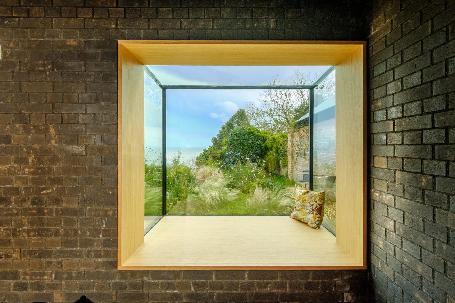 looking out at nature through oriel windows - structural glass - shire end - sieger systems