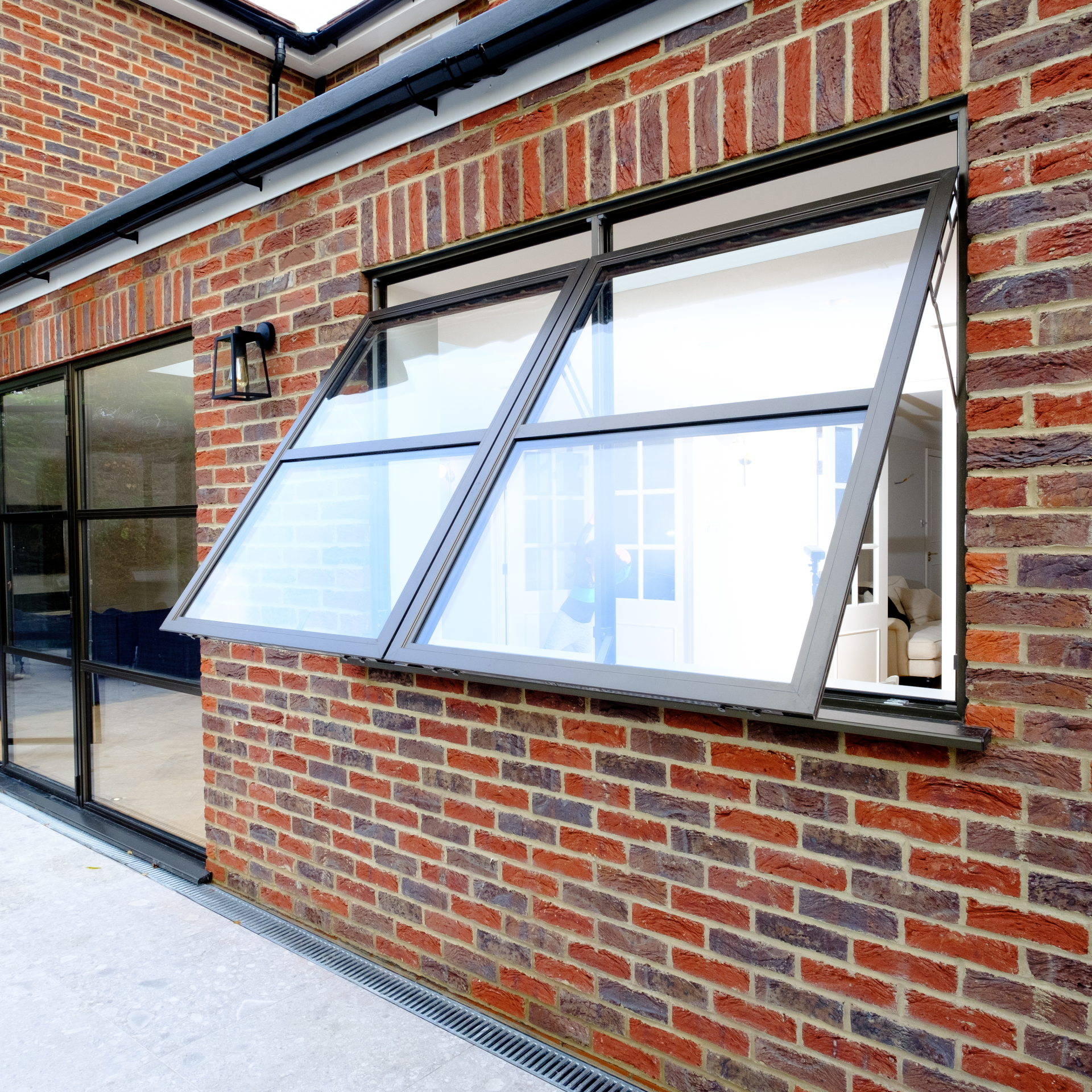 a window systems open off a brick building